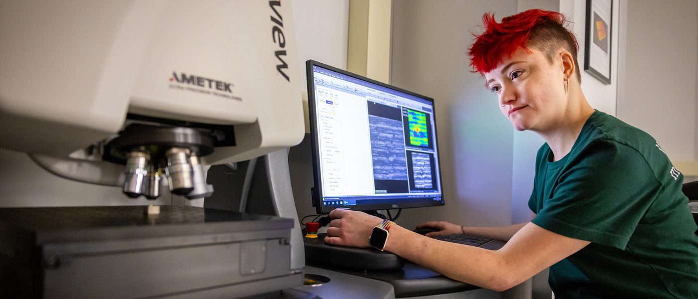 Student working on machine in Metrology Lab