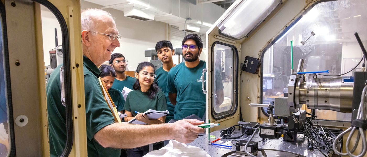 Dr. Jimmie Miller with a group of students